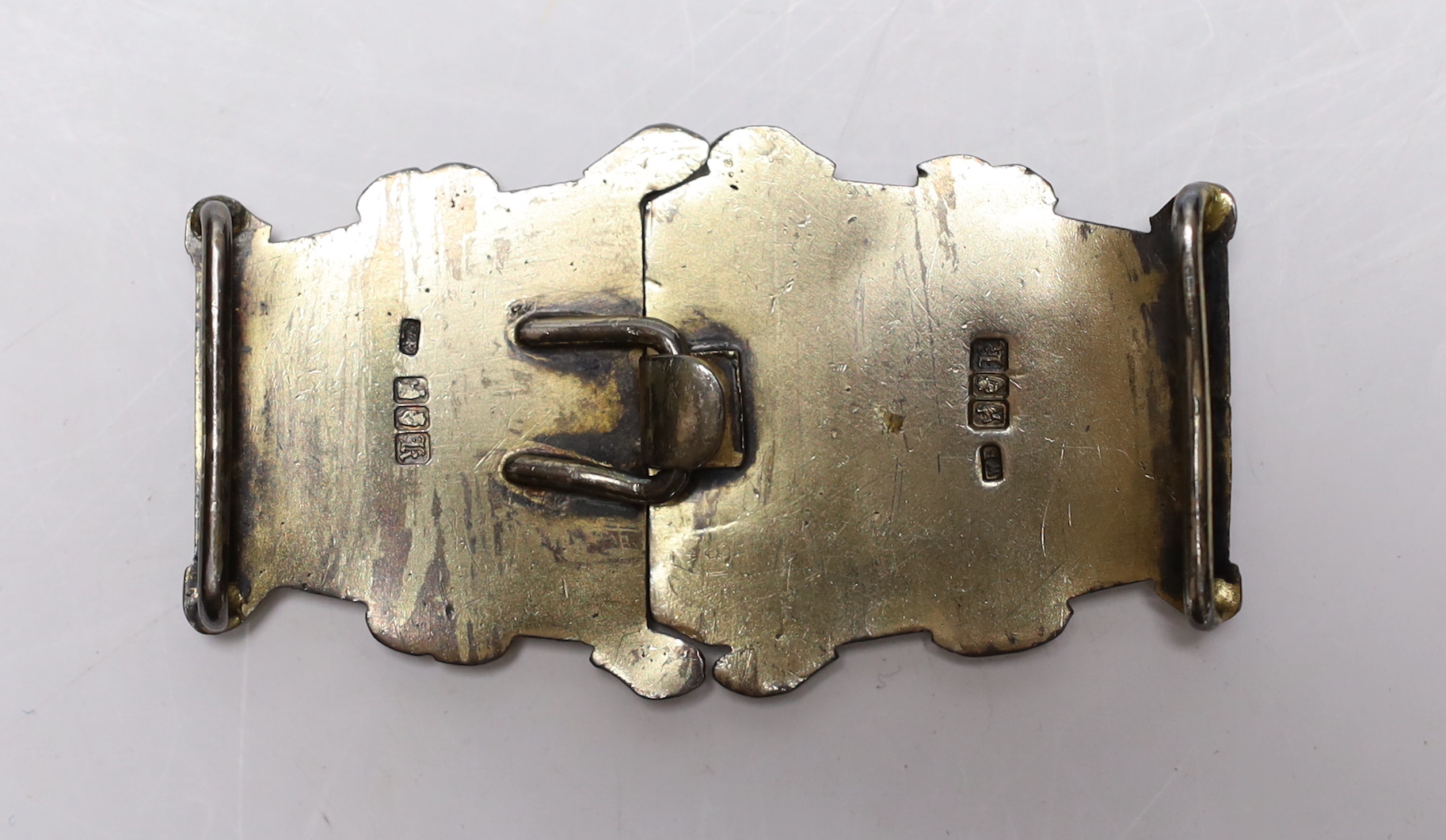 An Edwardian Arts & Crafts Irish silver belt buckle, maker W.P. Dublin, 1905, 7cm.
